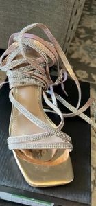 Rose gold lace up high heel shoes